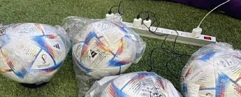 soccer balls being charged with RFID chips